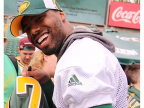 Eskimos wide receiver Shamawd Chambers signs autographs during Eskimos Fan Day at Commonwealth Stadium in Edmonton on Tuesday, July 4, 2017.