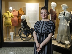 Anne Bissonnette, material culture professor in the Faculty of Agricultural, Life and Environmental Science at the University of Alberta, poses with the Misfits: Bodies, Dress and Sustainability exhibit at the Human Ecology Gallery in Edmonton, Alta. on Thursday, May 18, 2017.