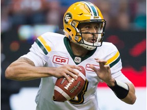 Edmonton Eskimos' quarterback Mike Reilly looks for a receiver during the first half of a CFL football game against the B.C. Lions in Vancouver, B.C., on Saturday, June 24, 2017.