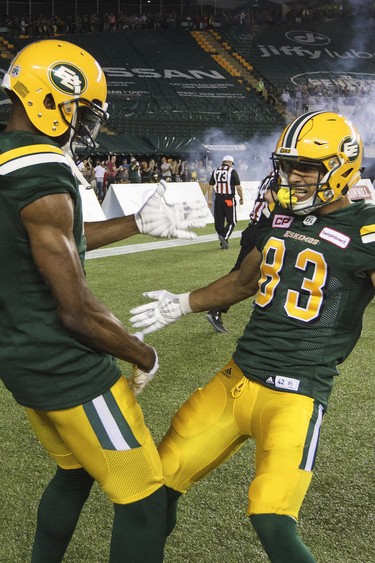 Edmonton Eskimos' Adarius Bowman (4) and Brandon Zylstra (83) celebrate a touchdown during second half CFL action against the Montreal Alouettes, in Edmonton on Friday, June 30, 2017.