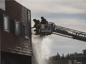 Firefighters work to put out a fire at 73 Street and 101 Avenue on June 25, 2017.
