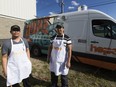 Edwin Badong and  Rodel Luquingan stand in front of the Hope Mission's new food truck, unveiled  at the Hope Mission's Youth Centre on Friday June 23, 2017, in Edmonton.