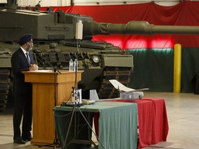 Defence Minister Harjit S. Sajjan answers questions about Canada's priorities in the space and cybersecurity behind a RQ-11 Raven army drone and computer equipment as part of Canada's new defence policy at 3 Division Support Base Edmonton at CFB Edmonton on Wednesday, June 14, 2017. Ian Kucerak / Ian Kucerak, Postmedia