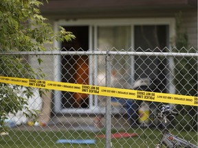 Edmonton Police officers investigate after a double stabbing at the Londonderry Heights apartment complex at 7220 144 Avenue in Edmonton, Alberta on Thursday, June 15, 2017.