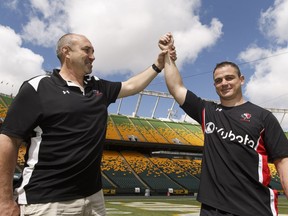 Canada's Aaron Carpenter (right), of Brantford, Ont., will break the record for games played during a test match on Saturday versus Romania poses with Al Charron of Ottawa after practice at Commonwealth Stadium in Edmonton on June 15, 2017.