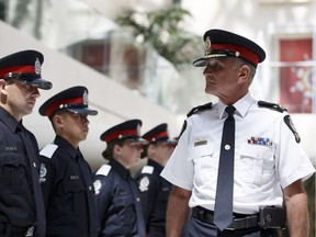 Chief Rod Knecht, right, inspects Recruit Training Class 140 during the Edmonton Police Service's official celebration of the 125th anniversary of the service's formation in 1892 during a ceremony at city hall in Edmonton, Alberta on June 20, 2017.