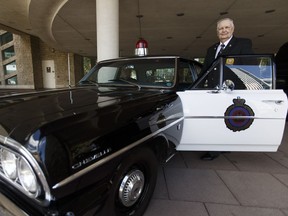 Retired police officer Ted Collinson gets into a restored 1964 Chevrolet Chevelle Malibu police car at the end of the Edmonton Police Service's official celebration of the 125th anniversary of the service's formation in 1892 at City Hall in Edmonton on Tuesday, June 20, 2017.
