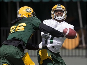 Linebacker Chris Edwards (left) slaps a pass away from wide receiver KJ Maye during Edmonton Eskimos practice at Commonwealth Stadium in Edmonton, Alberta on Thursday, June 22, 2017. The Eskimos their first regular season game on the road against the BC Lions on Saturday.