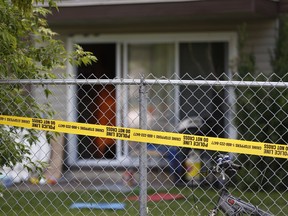 Police tape surrounds a north Edmonton apartment building at 7220-144 Ave. on Thursday, June 15, 2017. Photo by Ian Kucerak/Postmedia