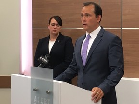 Acting Insp. Pamela Robinson and Staff Sgt. Stephen Camp address a media conference about charges laid against a rural Alberta man related to the sexual abuse of his three daughters over the course of six years.