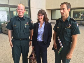 Environment Canada's Colin Fehr, Crown counsel Erin Eacott and Environment Canada's Daniel Smith outside provincial court in Edmonton after CN Rail received a $2.5 million fine for a 2015 diesel spill into the North Saskatchewan River.
