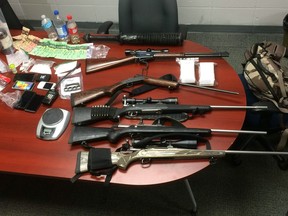 Police seized drugs, weapons and cash after executing a warrant in Parkland County on June 20, 2017.