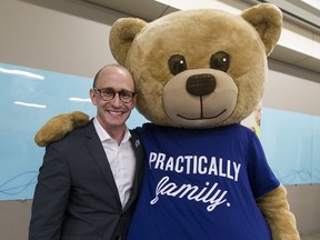 Jeff Kasbrick AMA VP, Government and Stakeholder Relations has his picture taken with Teddy the AMA bear after talking about the importance of the AMA School Safety Patrol program on Friday June 2, 2017, in Edmonton.