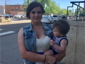 Julia Carriere with her one-year-old son Richard outside an Edmonton courthouse on June 7, 2017, after graduating from the Edmonton Drug Treatment Court Service.