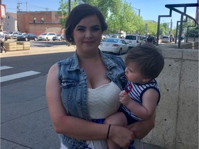 Julia Carriere with her one-year-old son Richard outside an Edmonton courthouse on June 7, 2017, after graduating from the Edmonton Drug Treatment Court Service.