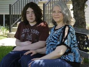 Lisa Phillips-Cardinal (right) and her son Michael at home on Thursday, June 1, 2017. Michael has a chronic debilitating pain condition that he developed after receiving acetaminophen at a hospital when he was 15.
