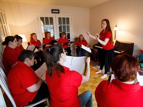 Deborah Mullan conducts as members of the Edmonton chapter of the Canadian Military Wives Choirs practice in Edmonton, Alta., on Sunday, June 11, 2017. (Codie McLachlan/Postmedia) This is for a story by Liane Faulder running on Monday June12.