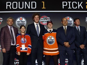 Five-foot-seven right-winger Kailer Yamamoto, centre, was drafted by the Edmonton Oilers 22nd overall in the first round of the NHL Draft.