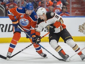 Griffin Reinhart of the Edmonton Oilers, makes his playoff debut against Jakob Silfverberg of the Anaheim Duck in Game 6 in the second round of NHL playoffs at Rogers Place on May 7, 2017.