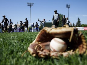 Players warm up during the Edmonton Prospects' open tryouts at Re/Max Field in Edmonton on May 27, 2017.