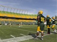Players watch from the sidelines during Edmonton Eskimos training camp at Commonwealth Stadium in Edmonton on Sunday, June 4, 2017.