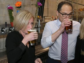 Alberta Premier Rachel Notley and Alberta Finance Minister Joe Ceci sample some beer with Cold Garden Brewery in Calgary on Monday March 27, 2017.