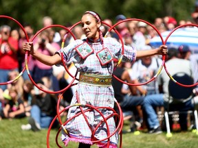 Sandra Larouche from Big Stone Cree performs a hoop dance during the First Nations Powwow for Canada Day 2015 in Calgary.