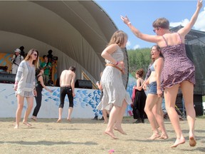 Music lovers dance in front of Geoff Berner at North Country Fair in 2015.