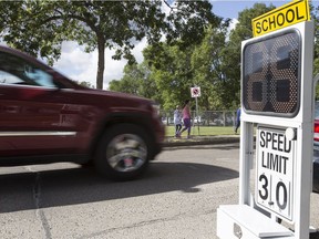 A speed sign is seen outside of Westglen School in Edmonton, on Sept. 2, 2014.