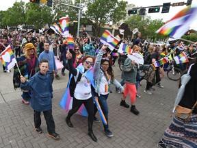 Spectators flood the streets as the end of the colourful annual Pride Parade which wound its way along Whyte Ave. to 104 St. in Edmonton, June 10, 2017. Ed Kaiser/Postmedia (Standalone Photo)