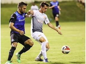 FC Edmonton midfielder Adam Straith, left, challenges Puerto Rico FC midfielder Conor Doyle for the ball in North American Soccer League play at Juan Ramon Loubriel Stadium in Bayamon, Puerto Rico, on Saturday, June 3, 2017. FC Edmonton are at the New York Cosmos on Wednesday.