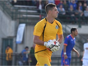 FC Edmonton goalkeeper Nathan Ingham holds the ball against Miami FC in North American Soccer League play at Clarke Stadium on June 10, 2017.