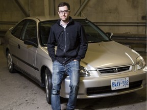 Former Journal reporter Tyler Dawson poses with his cherished car that he's trying to sell June 29, 2017.