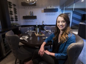 Cancer survivor Rickie-Lee Hildebrand sits in the Napa Valley-inspired wine room in the Cash and Cars Lottery dream home. Greg Southam/Postmedia
