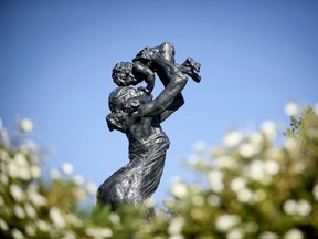 The New Life... New Beginnings sculpture by Richard Tosczak greets visitors at the entrance to Hawrelak Park.