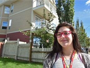 Resident Casandra Maslyk celebrates the 2016 opening of Hope Terrace, a facility run by the Bissell Centre.