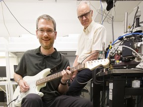 National Research Council of Canada Research Officer Adam Bergen, left, and Professor of Chemistry Richard McCreery pose for a photo in a lab at the National Institute for Nanotechnology, in Edmonton Monday, July 10, 2017. The duo have developed a guitar pedal that uses molecular electronic technology.