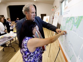 Ward 8 City Coun. Ben Henderson discusses the design and alignment of the future Central/East LRT line with a visitor to an LRT open house at the Bonnie Doon Community Hall on July 12, 2017.