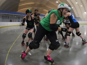Members of the E-Ville Roller Derby team practice at the Edmonton Sportsdome, 10104 32 Ave., in Edmonton on Thursday, July 20, 2017.