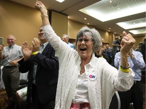 A unity supporter reacts after the Wildrose party voted in favour of uniting with the Progressive Conservatives, in Red Deer Saturday on July 22, 2017.