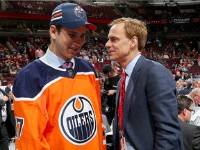 Kirill Maksimov meets with executive Scott Howson after being selected 146th overall by the Edmonton Oilers during the 2017 NHL Draft at the United Center on June 24, 2017 in Chicago, Illinois.