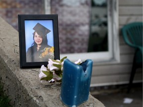 A memorial for Jordin Amber Aksidan, 21, grows outside of the Alexander Plaza apartment near 119A Avenue and 34 Street where Aksidan was found shot on Wednesday, July 5, 2017 in Edmonton, Alta. Aksidan later succumbed to her injuries in hospital.