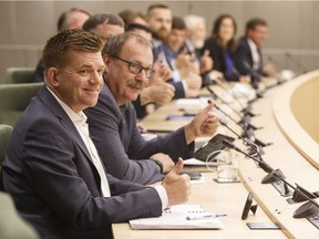 Brian Jean, left, and former house leader of the PC's Ric McIver sit together during the first meeting of the new United Conservative Party caucus in Edmonton Alta, on Monday, July 24, 2017.