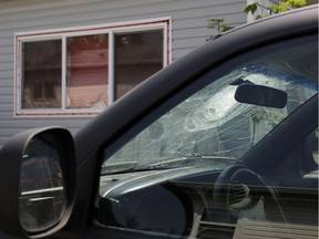 A shattered truck windshield and window at a home where an alleged assault occurred at 558 Evergreen Street in Edmonton. The victim later died, but no one has been charged.