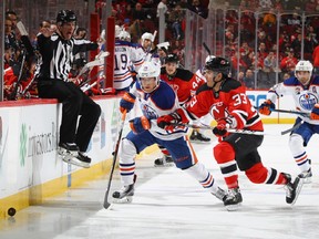 Yohann Auvitu as a New Jersey Devil, shown here defending against the Oilers' Drake Caggiula in January.