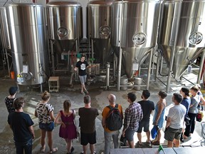 Head brewer Taylor Falk giving a tour at the Yellowhead Brewery which is part of a five brewery tour people paid for in Edmonton, July 15, 2017. Ed Kaiser/Postmedia (Edmonton Journal story by Claire Theobold)
Ed Kaiser