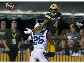 Montreal Alouettes Tyree Hollins (26) interfere with Edmonton Eskimos Adarius Bowman (4) during a convert attempt on Friday June 30, 2017, in Edmonton.