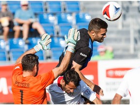 Edmonton's Adam Straith battles for possession against San Francisco's Cristian Portilla during FC Edmonton's NASL soccer game against the San Francisco Deltas at Clarke Stadium in Edmonton, Alta., on Saturday, June 24, 2017.