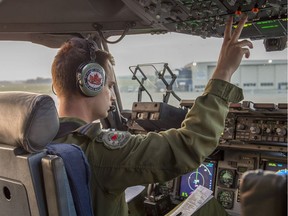 Capt. Craig Hughs prepares a CC-177 Globemaster for takeoff at 19 Wing Comox on its way to pick up emergency supplies at Edmonton airport to be delivered to Williams Lake, British Columbia, during Operation LENTUS on July 16, 2017.