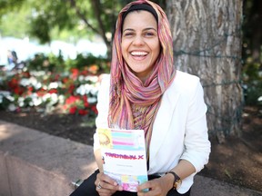 Teacher Sana Ayesha Ghani of Edmonton with a copy of Traditional X, a book she developed with her Grade 6-7 class in Cadotte Lake, on July 8, 2017.